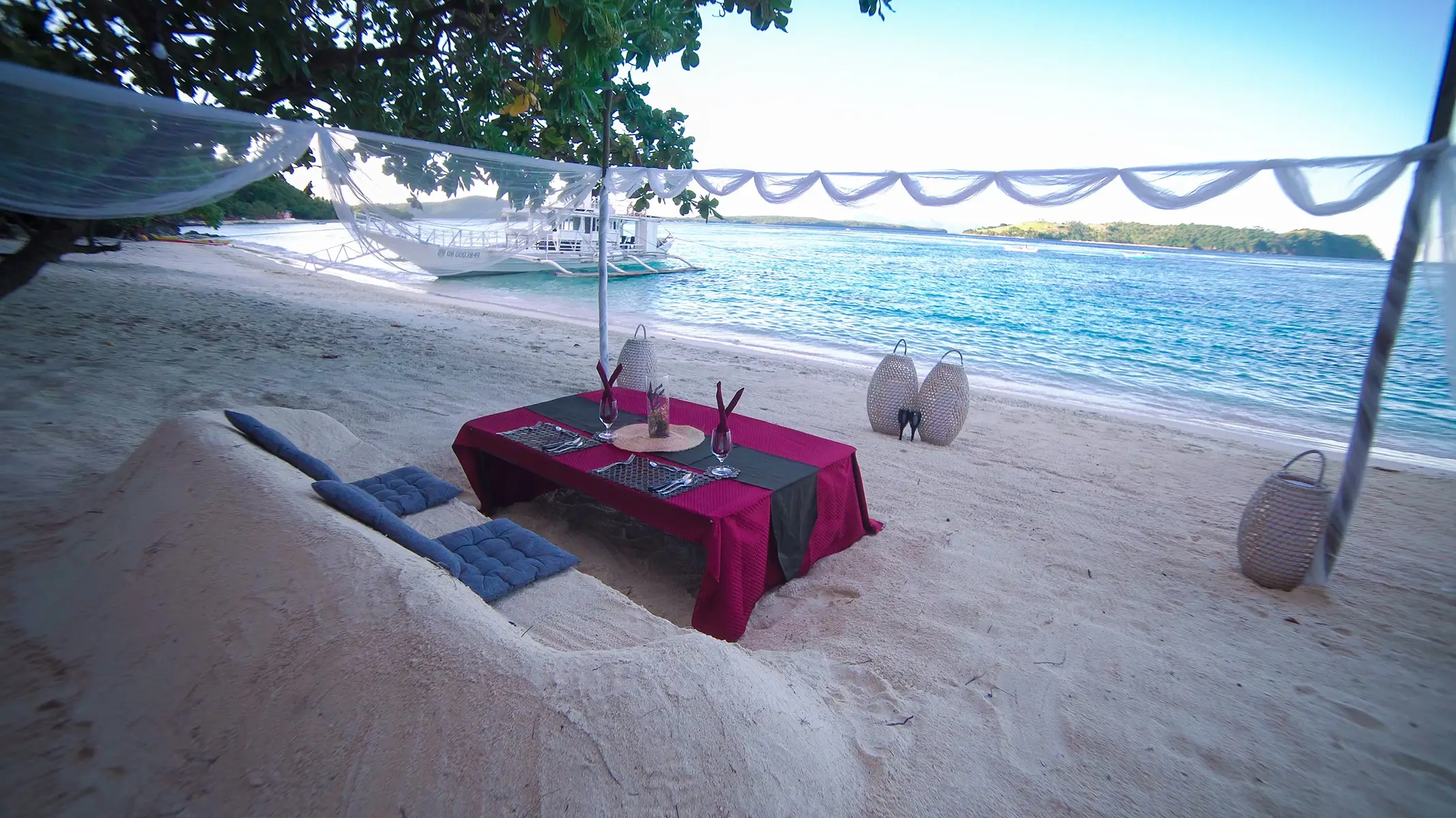beachfront dining setup at Sila Island Resort pink sand beach